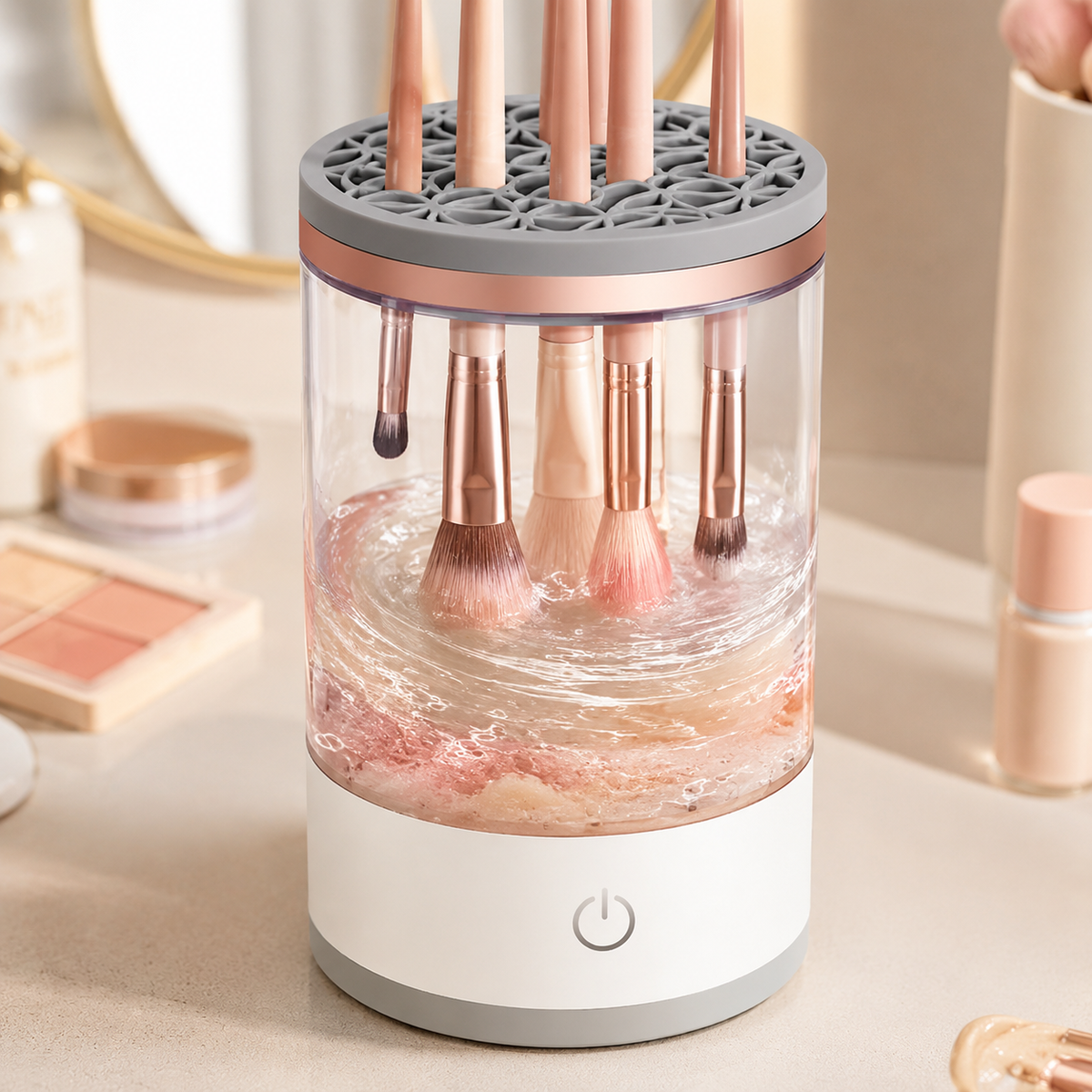 Makeup brushes being cleaned by circulating water inside the transparent bowl