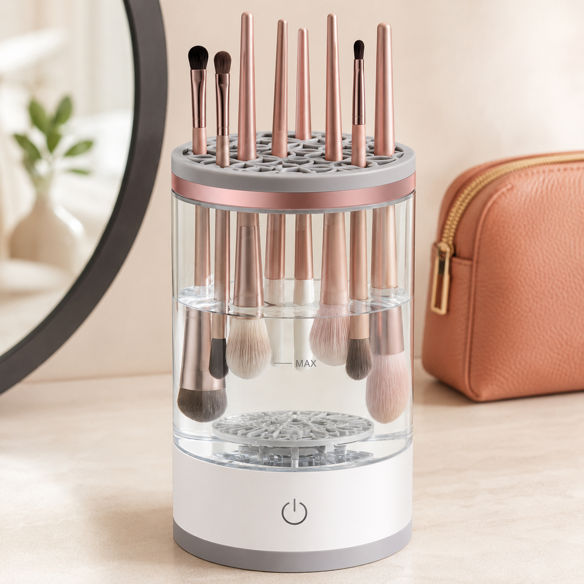 Automatic makeup brush cleaner holding brushes on a warm ivory vanity