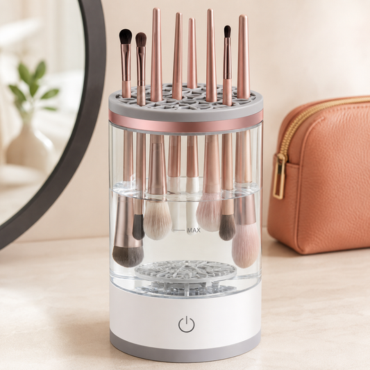 Automatic makeup brush cleaner holding brushes on a warm ivory vanity